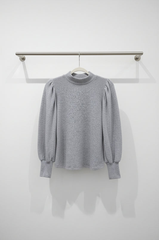 A light gray long-sleeve knit sweater 